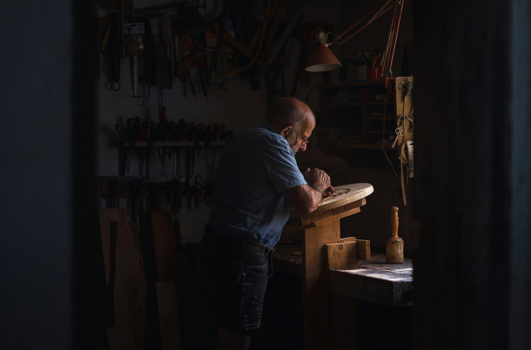 Krause Glucke at the workbench, shaping a Woodloft instrument
